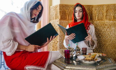 Women Reading Menu in Moroccan Hotel